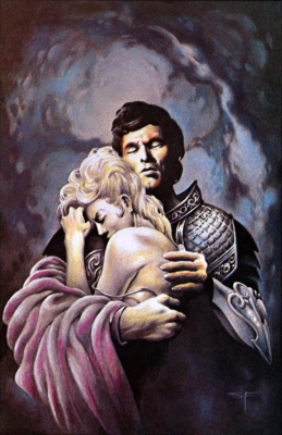 A man in armor and a woman embracing.