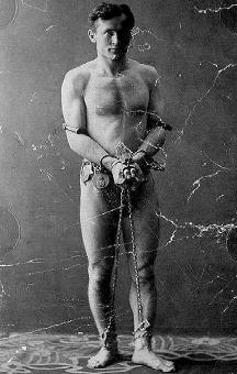 Harry Houdini before an escape act.