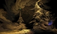 A tall pyramidal tower, crowned with a green light, in a surreal dark landscape.
