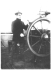 William Hope Hodgson at a ship's wheel